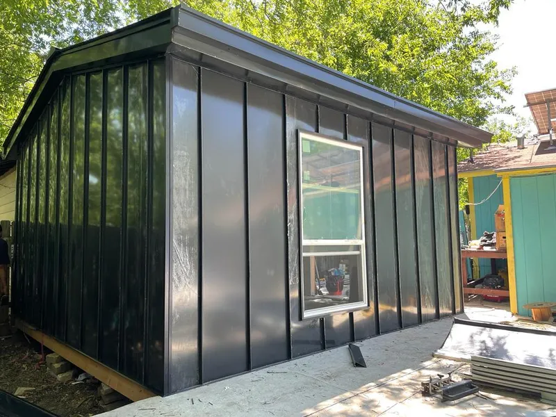 Black standing seam metal wall panels for Metal Roof Installation in Bondurant