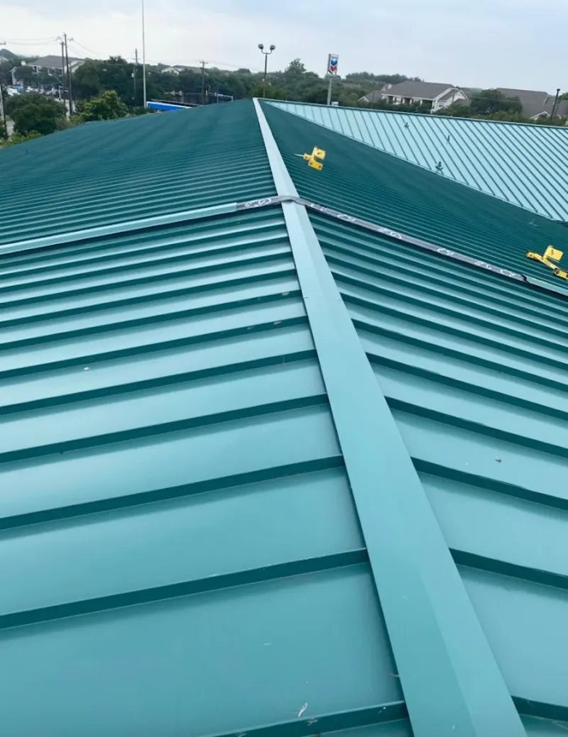 Green commercial metal roof ridge and valley for Metal Roof Repair in Bondurant